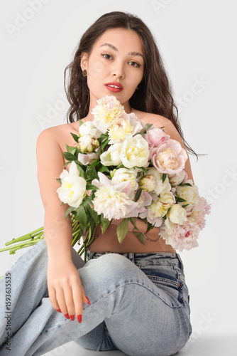 Young Asian woman with peon...