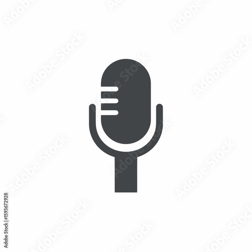 A simple, dark gray microphone icon on a white background, featuring a classic design with horizontal lines.