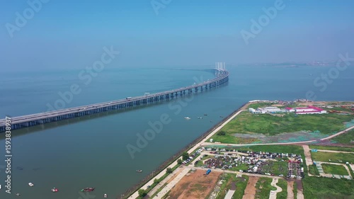 Breathtaking aerial view of Qingdao Jiaozhou Bay Crosssea Bridge highlighting its structural beauty and surrounding landscape
