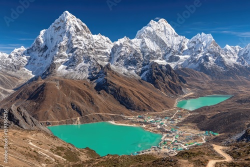 Himalayan peaks, turquoise lakes, and village nestled in valley