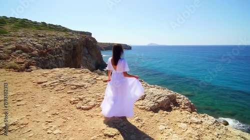 Woman in White Dress Walks Along Coastal Cliffside, Ocean View