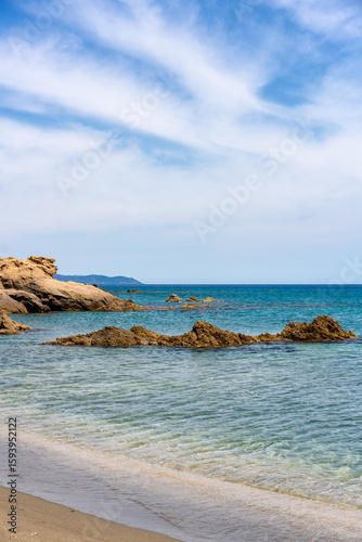 Fototapeta Naklejka Na Ścianę i Meble -  Sa Figu beach with rocks emerging from turquoise water in Sardinia, Italy