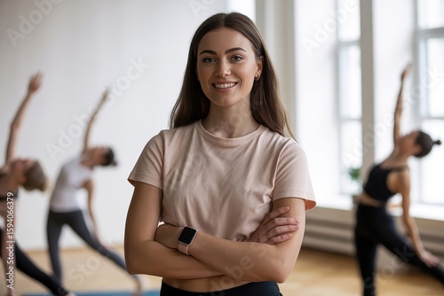 Smiling yoga instructor with arms crossed in a bright studio Free Download Smiling yoga instructor with arms crossed in a bright studio - GFXLoad
