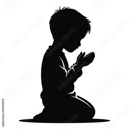 Black silhouette of a young boy kneeling and praying with hands cupped child