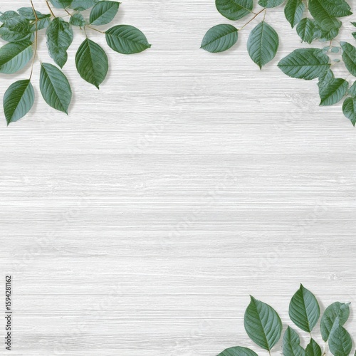 Lush green leaves arranged symmetrically on a light wood background, creating a natural frame with ample copy space