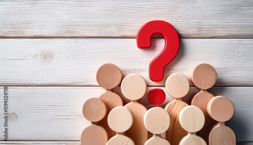 Group of Wooden Figures Looking Up at Big Red Question Mark on White Wooden Wall Background