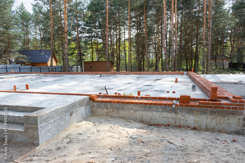 Wallpaper Mural Concrete slab of foundation of house with laid pipes start of construction on project. Construction of cottages, design, engineering communications. Torontodigital.ca