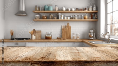 Light brown wooden tabletop in front of a blurred kitchen.