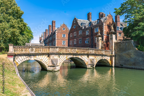 Landscape with River Cam, historic stone bridge and classic university buildings in Cambridge, England
