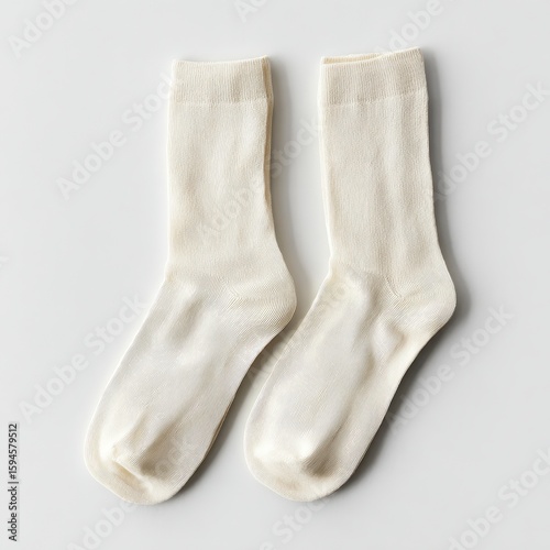 A pair of white socks on a white background