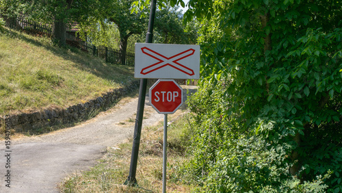 Photography Rural crossroads with vibrant stop sign, invoking Road Safety Week, unexpected p