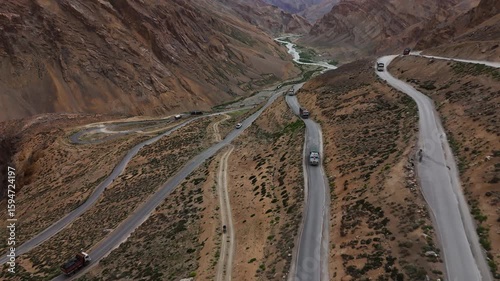 Trucks on Winding Mountain Road in Spiti Valley Drone View