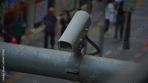 Urban surveillance cameras monitor the bustling life of streets in a busy city environment