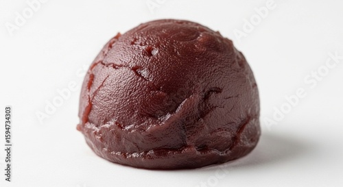 Wallpaper Mural Close-up of a single, round portion of dark red bean paste, possibly Anko, against a plain white background. Torontodigital.ca