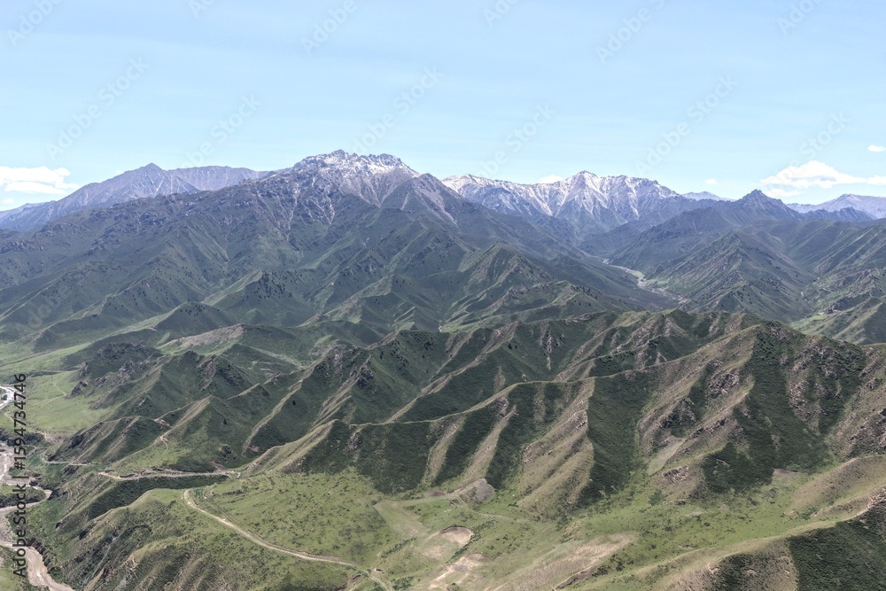 Naklejka premium The aerial view of Qilian grassland and Qilian Mountains
