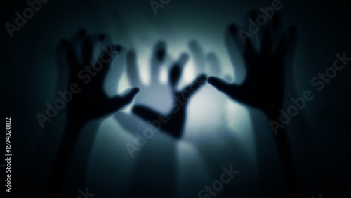 Fotografi Silhouettes of many human hands behind translucent glass, curtain