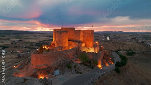 Aerial view of the windmills of Consuegra at night, Castilla-La Mancha, Spain.