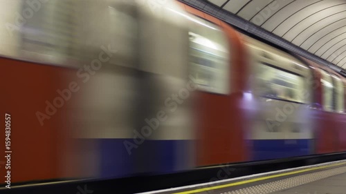 Tube train loop.
Never-ending London tube train going past a platform. Loops.