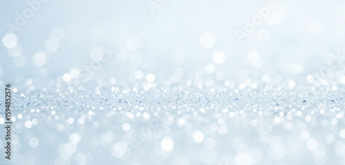 Abstract background with blurred white and light blue bokeh lights, offering a gentle and clean atmosphere perfect for tech visuals, medical designs, or cool-themed content.