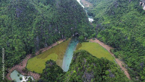 Bild auf Leinwand Ninh Binh Vietnam - Aerial Drone View of Traditional Sampan Boats Rowed by Foot