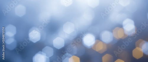 Abstract background with blurred lights in blue and gold tones, creating a cool yet festive mood perfect for premium product branding, stylish digital banners, or evening-themed visuals.
