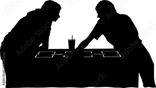 Silhouette of two people playing foosball with a drink on the table in a dark room setting scene