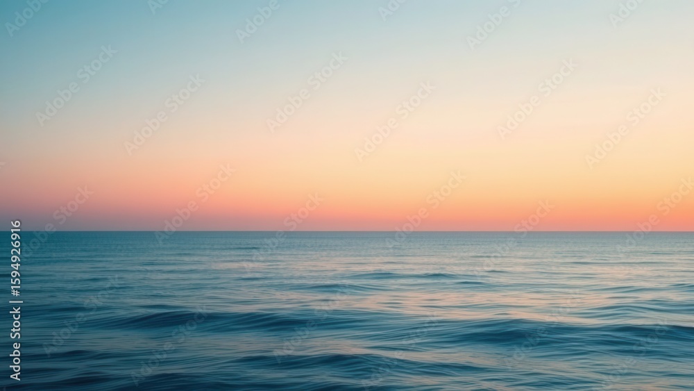 Fototapeta premium Ocean and Sunset with a soft gradient from deep blue to warm peach