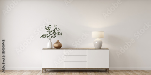 Modern white console table with decorative vases and plants in a minimalist room