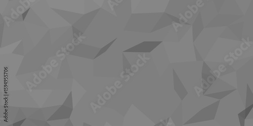 Abstract gray geometric pattern composed of various polygonal shapes, creating a faceted effect. 