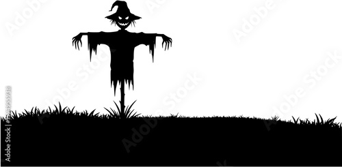 Creepy scarecrow silhouette standing in a field on halloween night