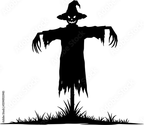 Creepy scarecrow silhouette standing in a field on halloween night