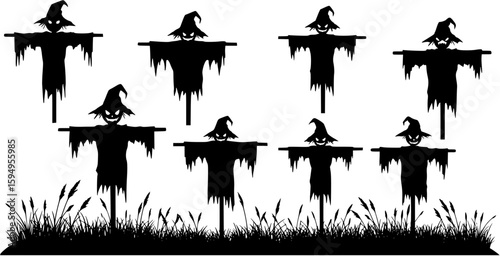 Creepy scarecrow silhouette standing in a field on halloween night