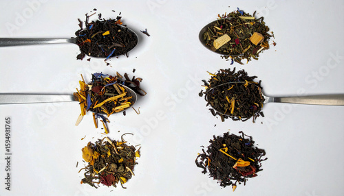 Collection of herbal teas and tisanes on isolated white background with textured surface and soft directional lighting