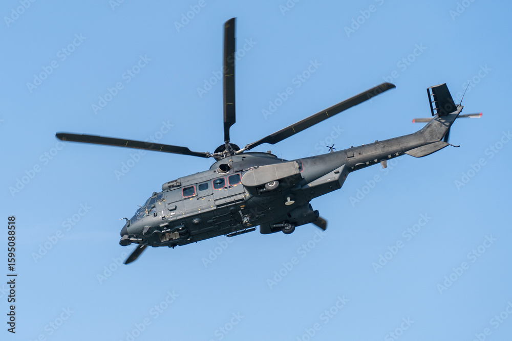 Fototapeta premium Black painted modern military transport helicopter in Hungary