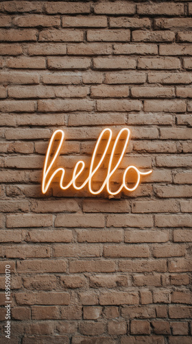 Hello neon sign glowing on brick wall background