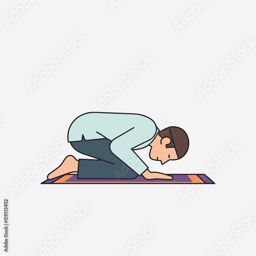 Man kneeling on a mat with his head down in prayer position.