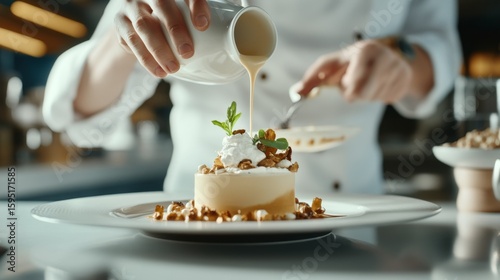 Chef pouring sauce on creamy dessert whipped cream nuts garnish Food Culinary