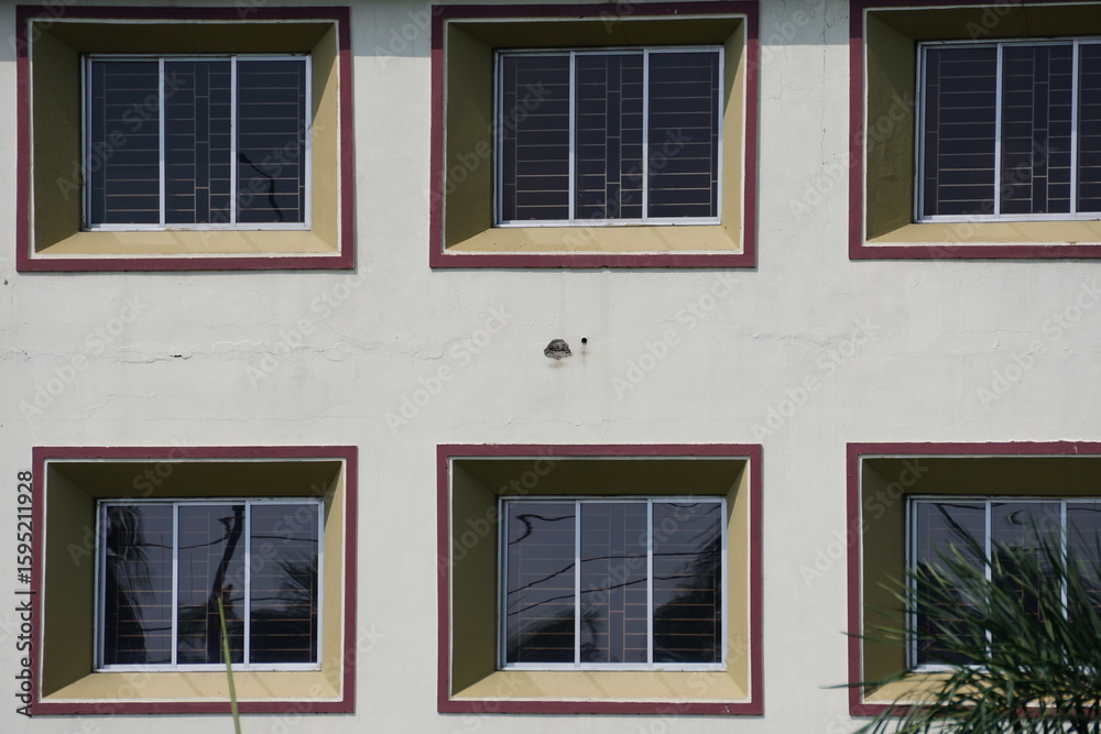 Fototapeta premium Ornamental architectural designed windows on the exterior wall 