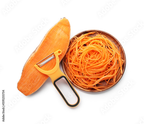 Foto Vegetable noodles, sweet potato and peeler isolated on white, top view