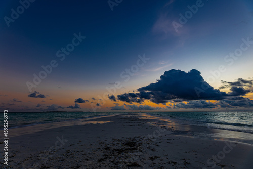 Fototapeta Naklejka Na Ścianę i Meble -  Sunset Swing in the Maldives Ocean