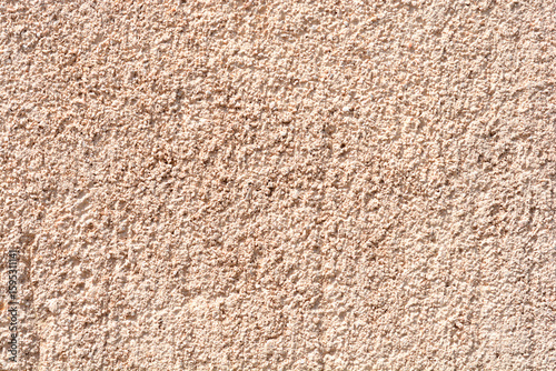 Wallpaper Mural A close-up shot captures the rough, granular texture of a light beige exterior facade, featuring subtle vertical scoring marks Torontodigital.ca