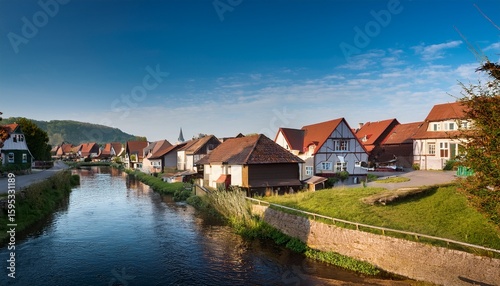 a small town with houses on both sides of a river