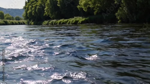 Scenic Riverside Landscape with Tranquil Water and Lush Greenery