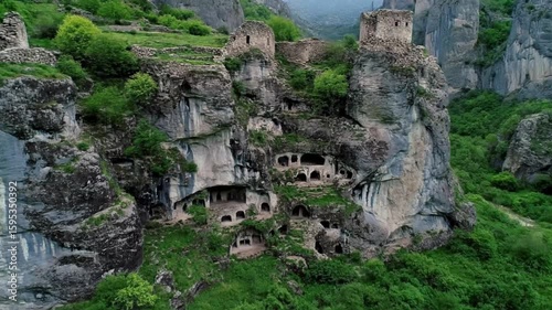 Ancient cave architecture carved into a rocky mountain cliff offers a glimpse into the history and cultural heritage of vardzia, georgia