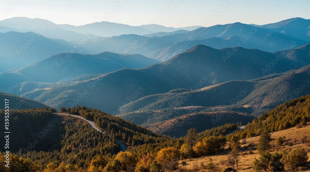 Obraz premium Mountainous Landscape with Sunlit Rolling Hopes