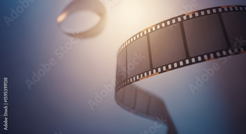 Cinematic Film Strip Unwinding in a Dreamy Glow – Movie Production and Nostalgia