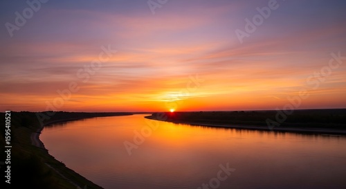 Spectacular sunset reflected on the tranquil river, creating a breathtaking landscape painting