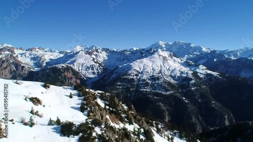 Wallpaper Mural Snowy mountain range under a clear blue sky Torontodigital.ca