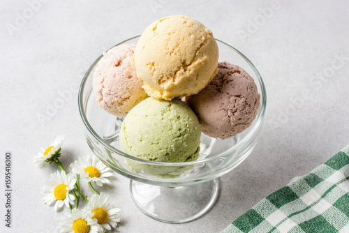 Colorful ice cream scoops with daisies.