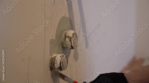 Apartment renovation. Isolation of electricity, preparation for connection. Painting walls with a brush around insulated wires. High quality 4k footage